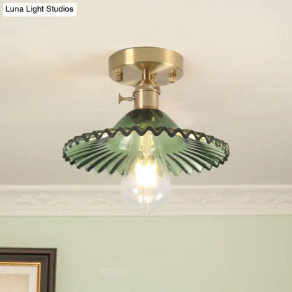 Green ribbed glass one-light ceiling light with scalloped ribbed glass and brass-finished mounting base from decorbites