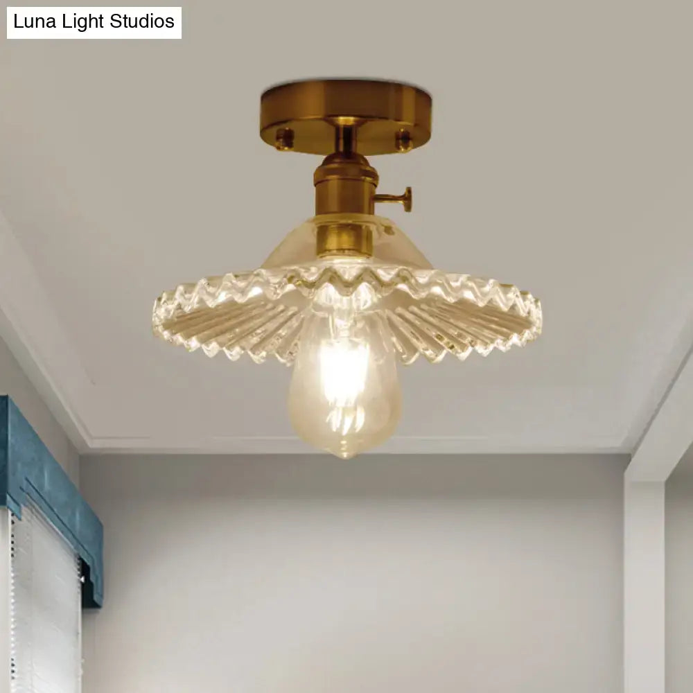 Decorbites industrial one-light ceiling light with vintage brass finish and clear scalloped ribbed glass shade