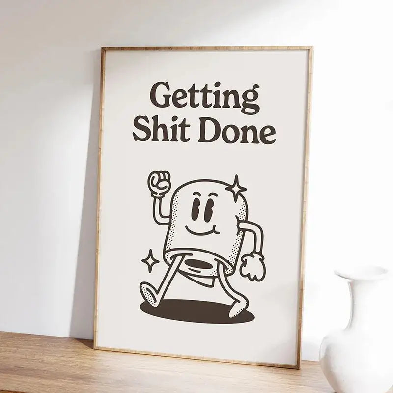 A framed DecorBites™ inspirational quote poster featuring a black and white animated marshmallow design in a light wood frame