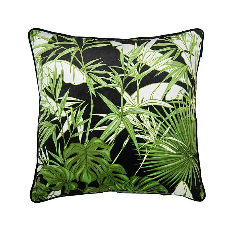 Square cushion cover featuring vibrant tropical green leaves on black background with black border by decorbites intersecting geometric