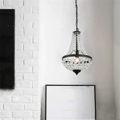 Black metal decorbites iron art crystal chandelier with tiered bell-shaped design and dangling crystal beads for dining room lighting