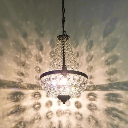 A decorbites iron art crystal chandelier dining room light with sparkling crystals and black iron frame hanging chain