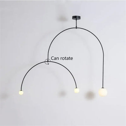 Black metal pendant light with three frosted glass bulbs and rotating arc design decorbites iron balance chandelier