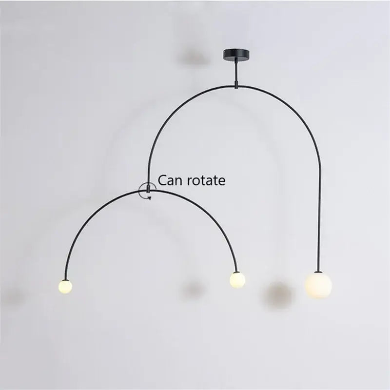 Black metal pendant light with three frosted glass bulbs and rotating arc design decorbites iron balance chandelier