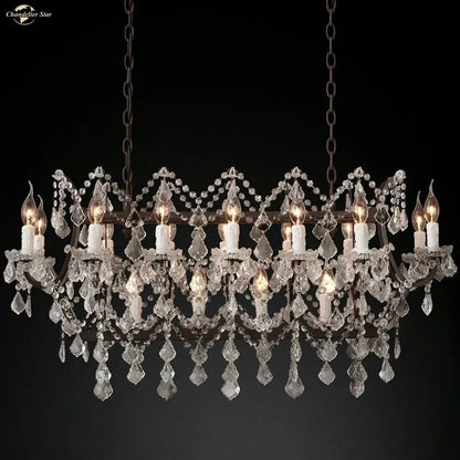 A decorbites iron crystal led chandelier with a dark metal frame and cascading clear crystals for kitchen lighting