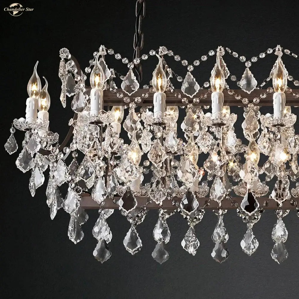 A decorbites iron crystal led chandelier with candle style bulbs and intricate glass droplets for kitchen lighting