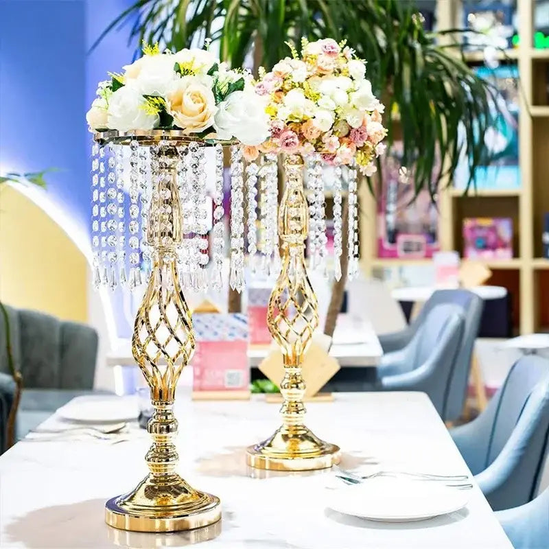 Gold-colored iron flower racks by DecorBites™ feature crystal chandelier centerpieces with lattice designs and rose arrangements