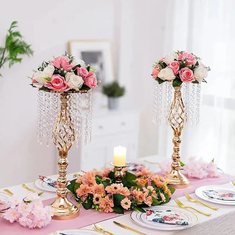 Gold-colored iron flower racks with crystal chandelier-style holders featuring pink and white roses for table decor
