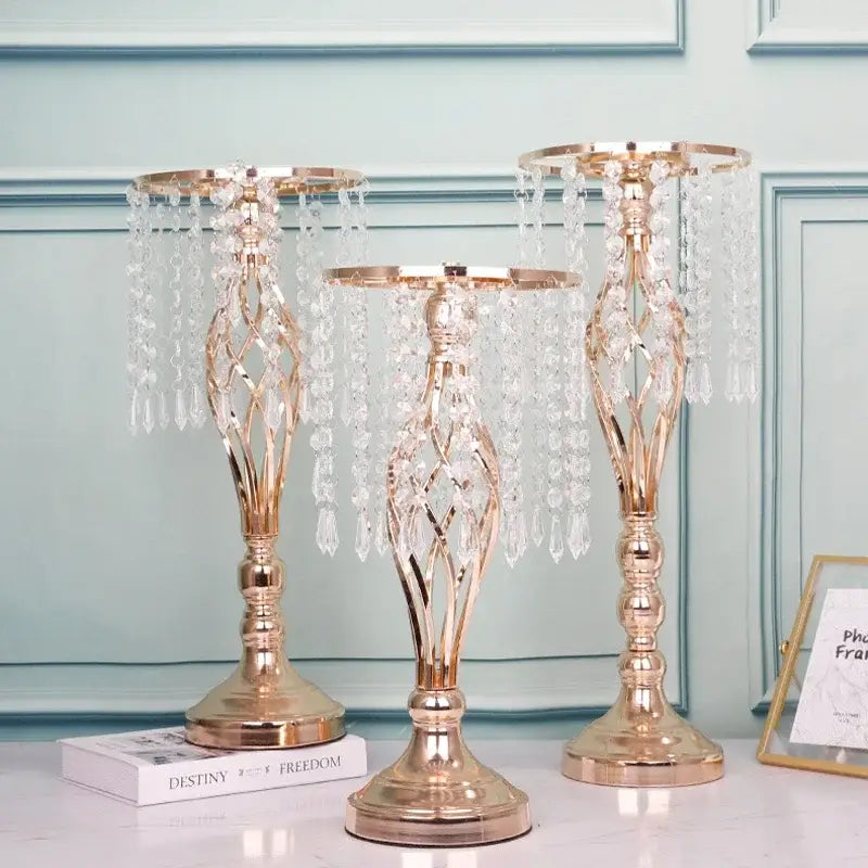 Three elegant rose gold crystal chandeliers complement iron flower racks for dining table decoration by decorbites