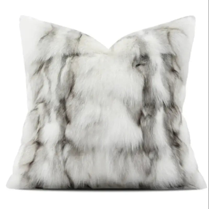 A plush square decorbites italian luxury pillowcase with soft white and gray faux fur texture for living room use