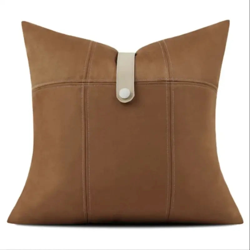 Tan suede throw pillow with cream leather strap and button closure from decorbites italian luxury pillowcase collection