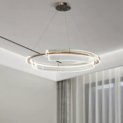 Modern double-ring led chandelier with clear acrylic rings and gold-toned metal accents by decorbites italian minimalist