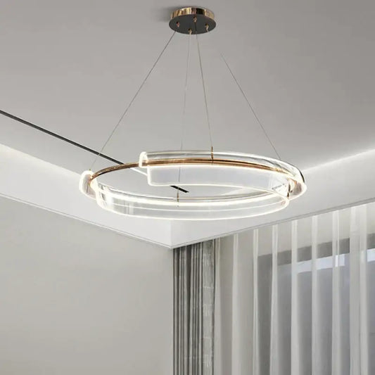 Modern double-ring led chandelier with clear acrylic rings and gold-toned metal accents by decorbites italian minimalist
