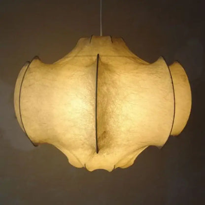 Warm softly glowing pendant light with cream italian silk layered shade by decorbites for dining room use