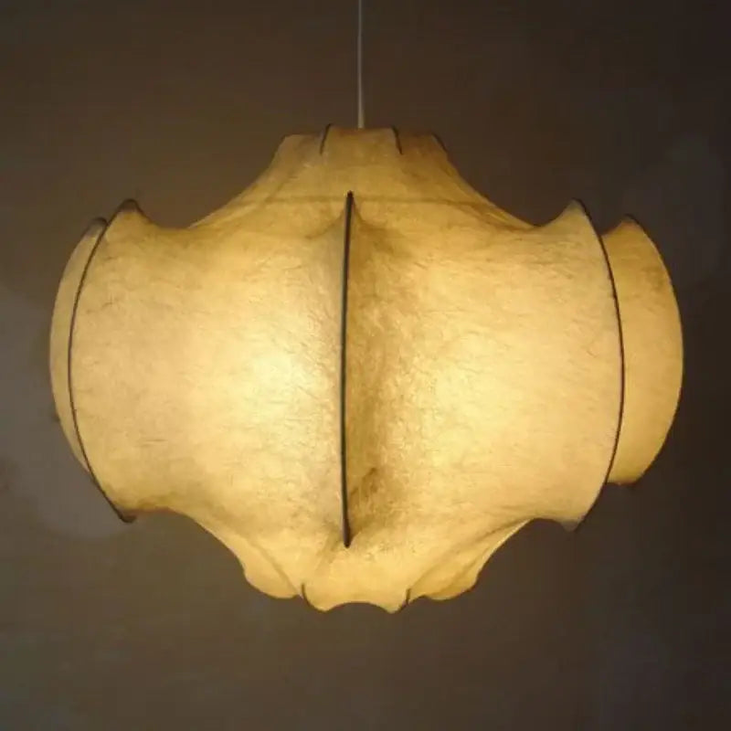 Warm softly glowing pendant light with cream italian silk layered shade by decorbites for dining room use