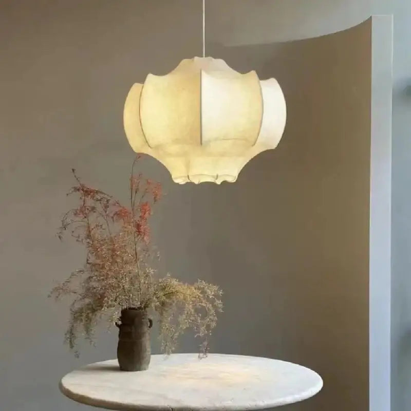 Cream-colored pleated paper pendant light from Decorbites italian silk with soft diffused glow for the dining room