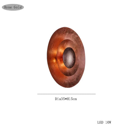 Rose gold oval wall sconce with concentric circular design and led lighting by Decorbites italian vintage for living room