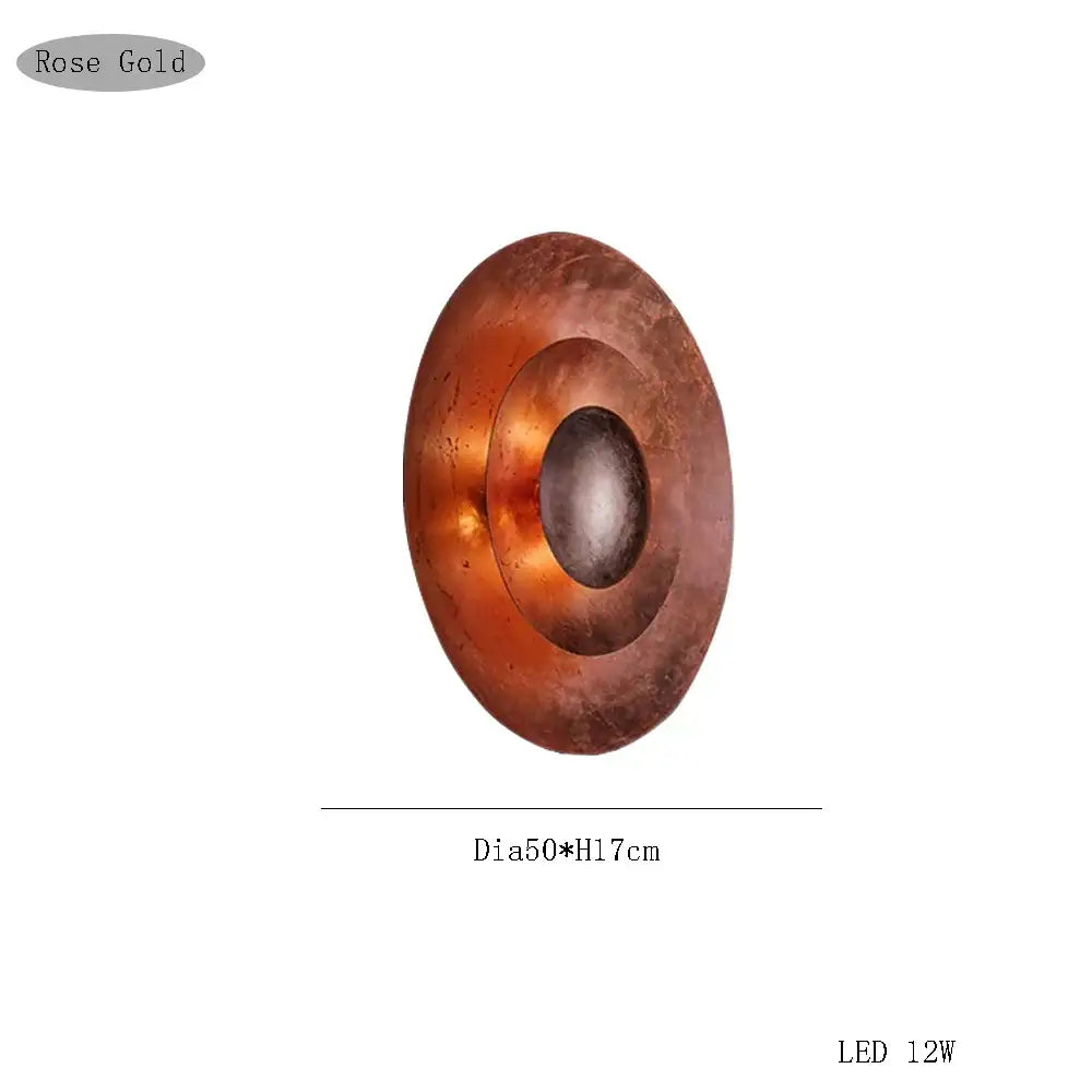 Rose gold circular led wall sconce with concentric ring design by decorbites italian vintage for living room use