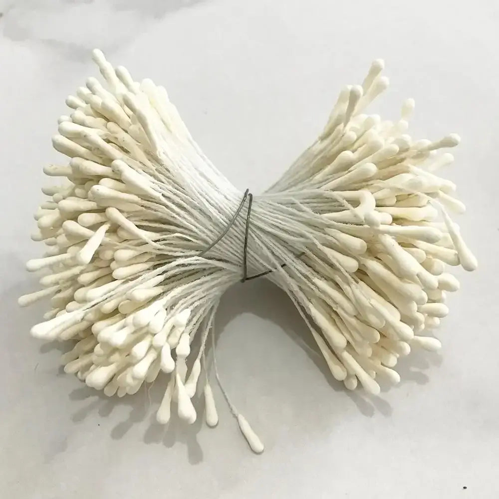 A bundle of white cotton swabs tied with thin wire in decorbites ivory flower cherry stamen wedding decor
