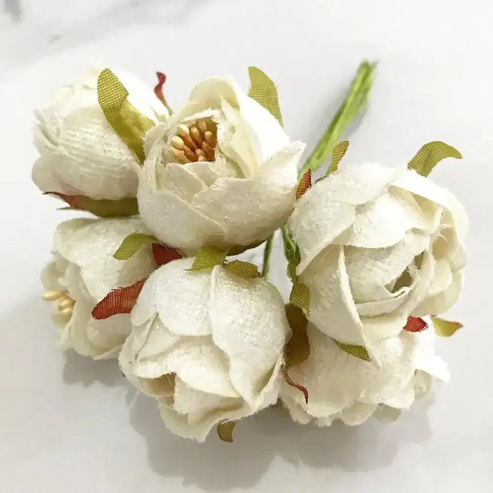 A delicate cluster of decorbites ivory flower cherry fabric peonies with flower cherry stamen and green rust leaves for wedding decor
