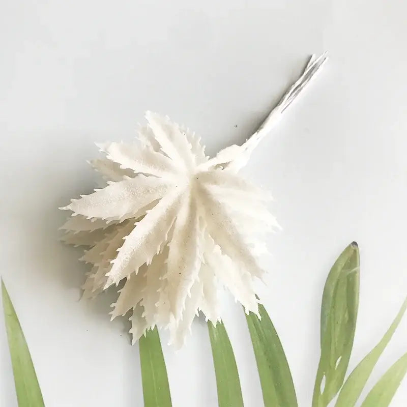 A delicate decorbites ivory flower cherry artificial leaf with serrated edges and metallic stem for wedding decor