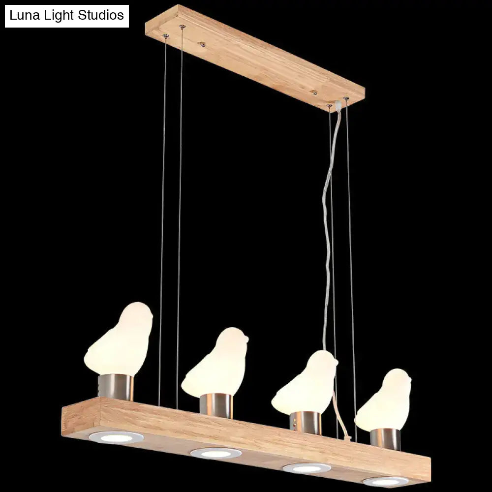 Decorbites™ ivory glass bird island pendant lighting fixture with four illuminated frosted glass birds on wood beam