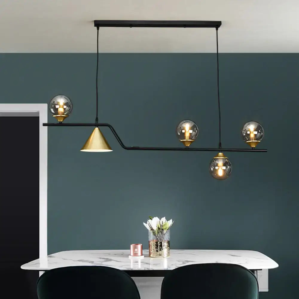 Modern black metal pendant light with gold-toned cone and spherical ivory glass bulbs for ivory glass island pendant use