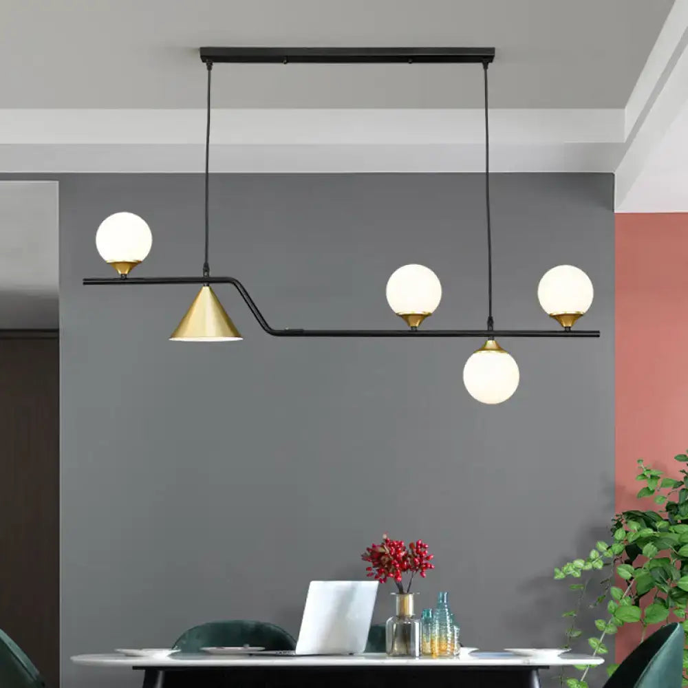 Modern black and brass glass island pendant light with ivory glass globes for 110v-120v or 220v-240v use in restaurants