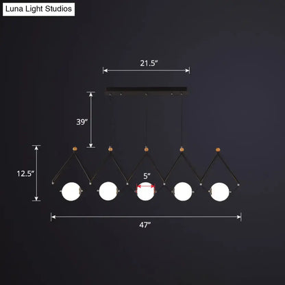 Black metal suspension light with five ivory glass spherical bulbs on angled arms for restaurant suspension light use
