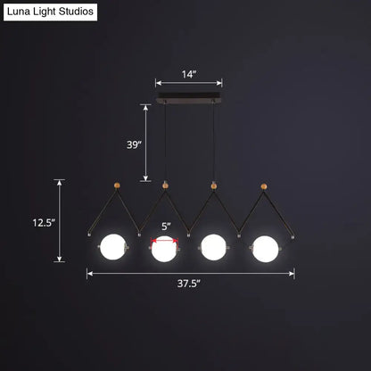 Modern black metal DecorBites™ suspension light with four white glass bulbs and wooden accents for restaurant use