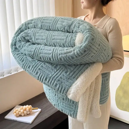 A soft light blue decorbites jacquard lamb wool double-layer blanket with plush white fleece lining for cozy comfort
