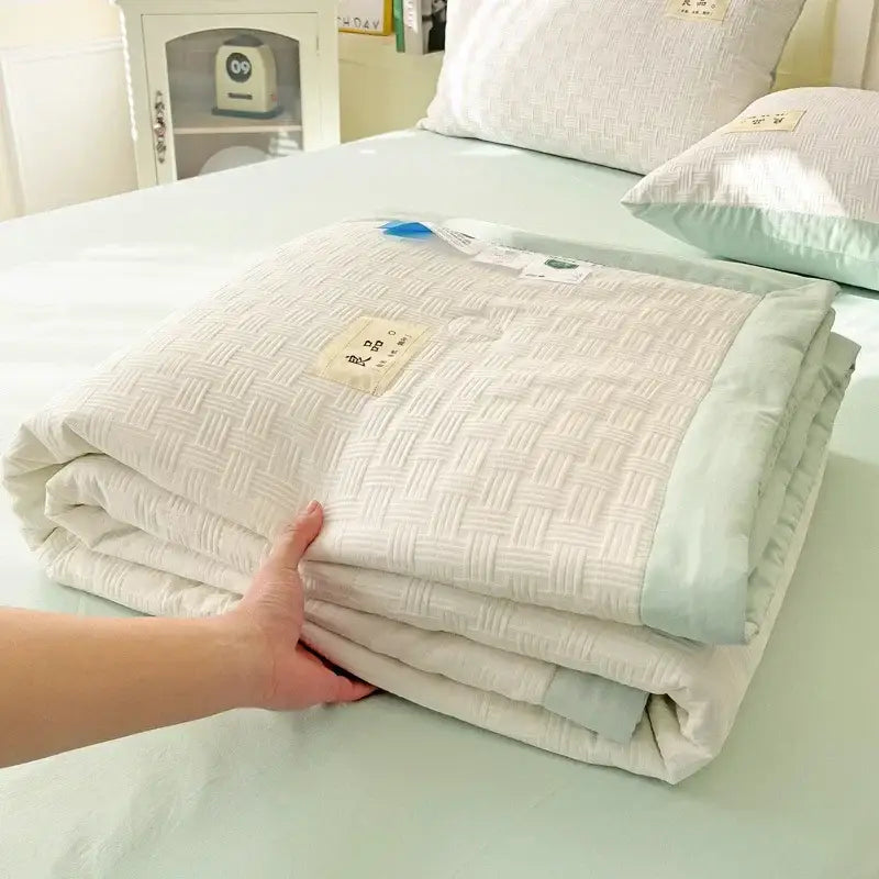 Decorbites jacquard summer cool blanket white off-white quilt with woven texture and light mint green piping edges