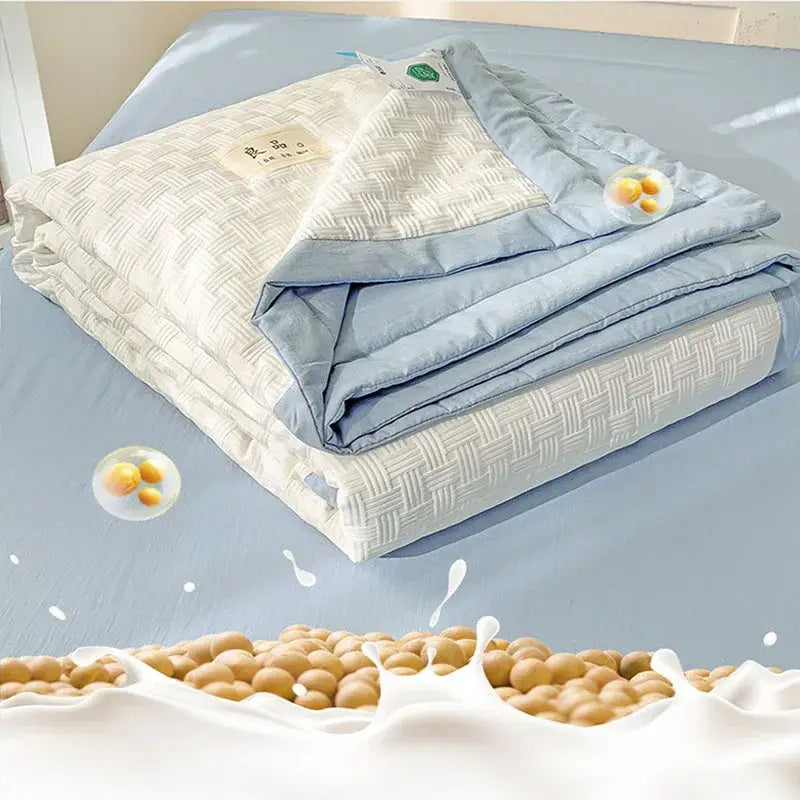Light blue and cream decorbites jacquard summer cool blanket with woven texture and subtle pattern for bedroom use