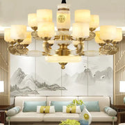 Gold-toned decorbites jade copper chandelier with frosted opal glass shades and ornate decorative elements for living room