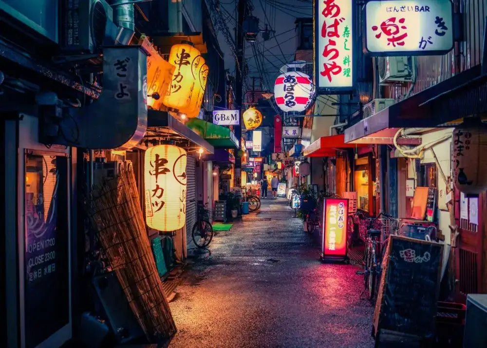 Decorbites™ japanese city landscape canvas wall art featuring warmly glowing yellow paper lanterns in a dark alleyway