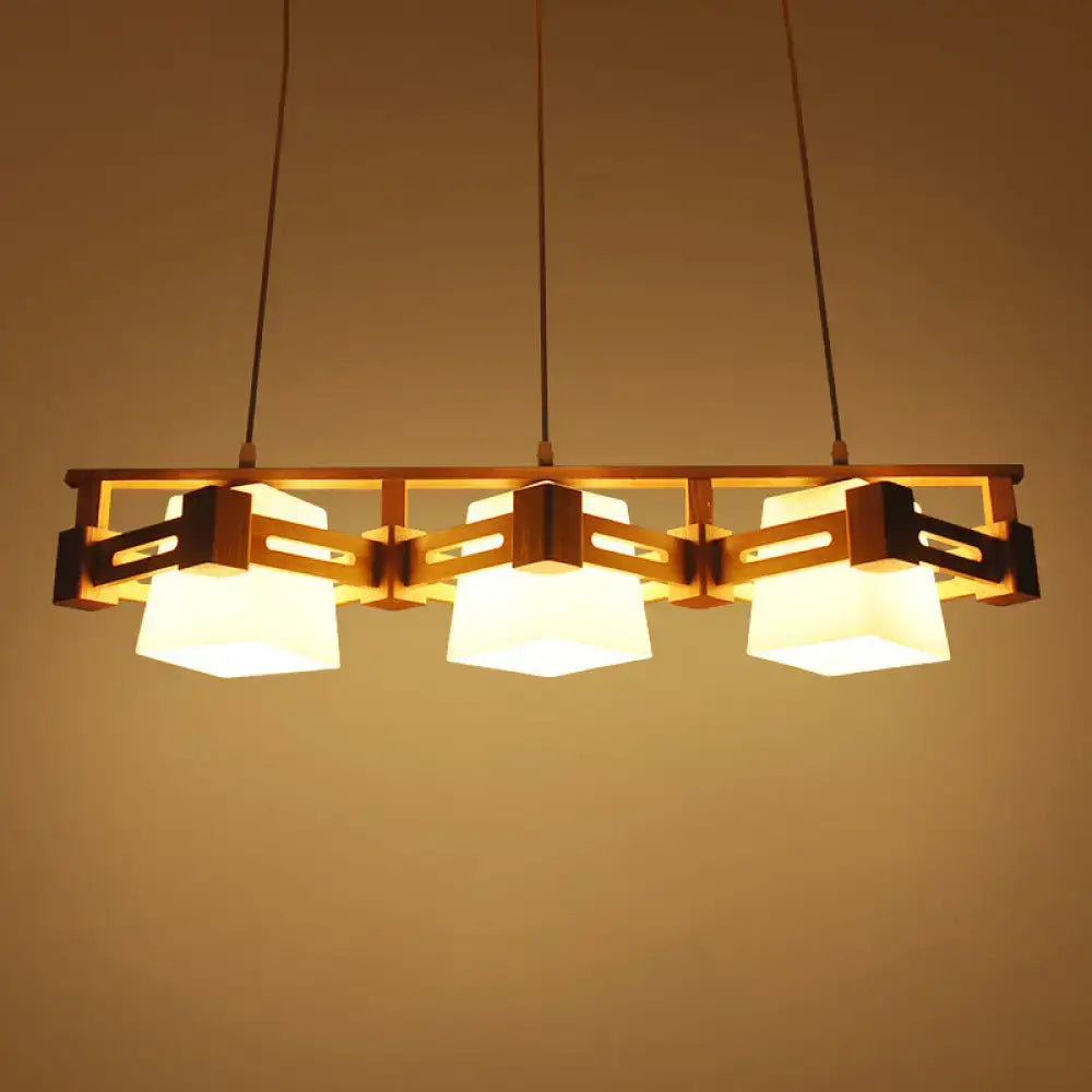 Warm-toned wooden pendant light with three cream trapezoid frosted glass shades for dining room 220v-240v led use