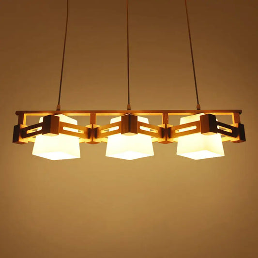 Warm-toned wooden pendant light with three cream trapezoid frosted glass shades for dining room 220v-240v led use