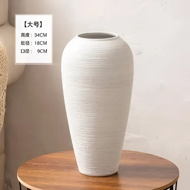 A tall off-white ceramic hydroponic vase with a textured ribbed surface and a flared rim from decorbites japanese minimalist hydroponic set