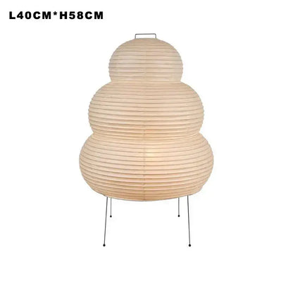 Beige three-tiered floor lamp with ribbed japanese style paper shade and slender metal legs by decorbites for living room lighting