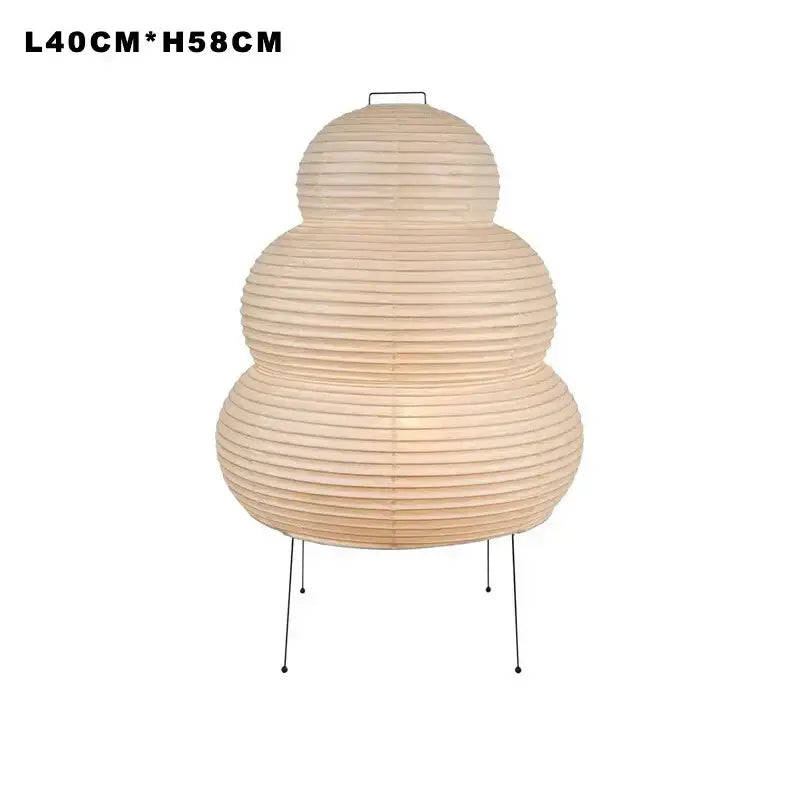 Beige three-tiered floor lamp with ribbed japanese style paper shade and slender metal legs by decorbites for living room lighting