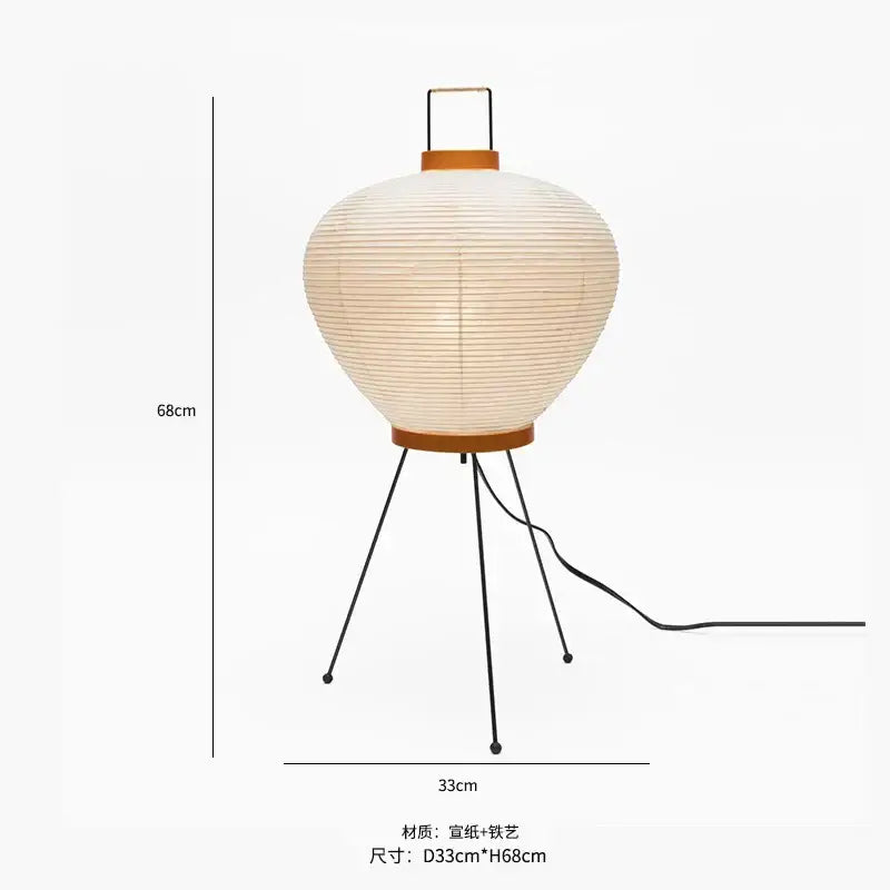 Cream-colored decorbites japanese style floor lamp with paper lantern, wooden handle, and black metal tripod legs