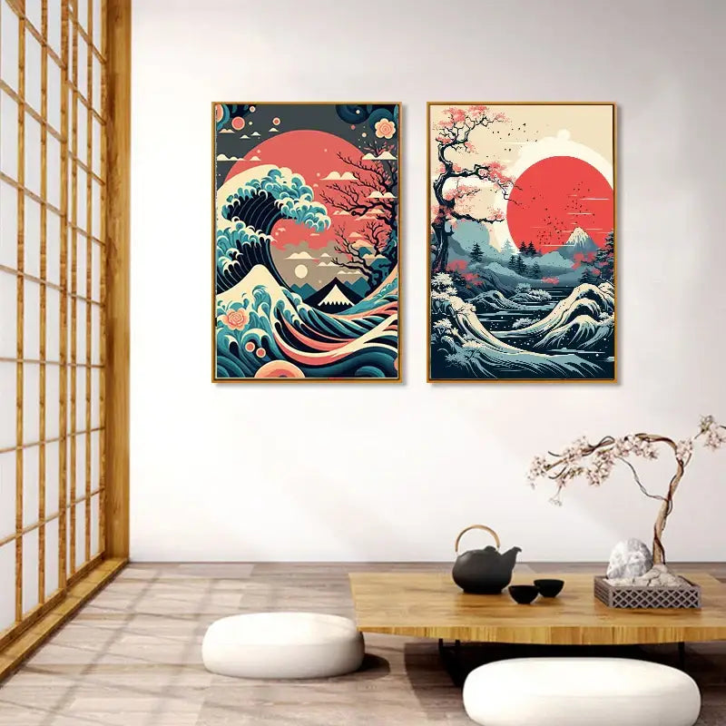 Two framed japanese vintage art canvases with stylized waves red suns and cherry blossoms in vibrant blue and pink tones