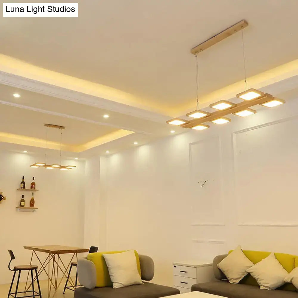 Modern rectangular led pendant light with natural wood frame and acrylic shade for restaurant and island lighting