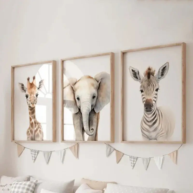 Set of three framed watercolor animal nursery wall art prints featuring giraffe elephant and zebra in soft earth tones