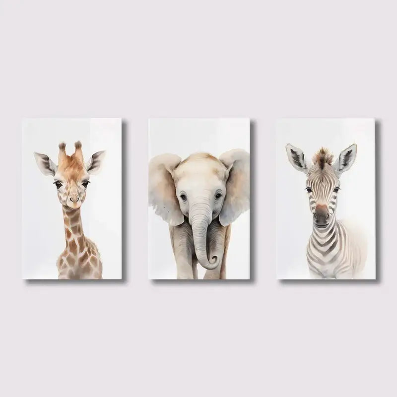 Set of three decorbites™ watercolor animal nursery wall art featuring giraffe, elephant, and zebra on canvas