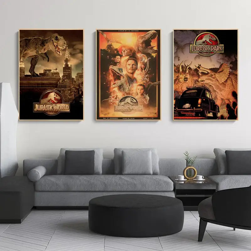 Three framed jurassic park dinosaur canvas posters hang above a gray sectional sofa in decorbites™ wall art display