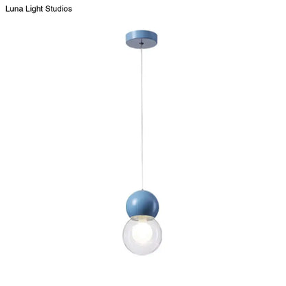 Blue spherical kids bedside pendulum light with clear glass globe and milky macaron ceiling pendant design