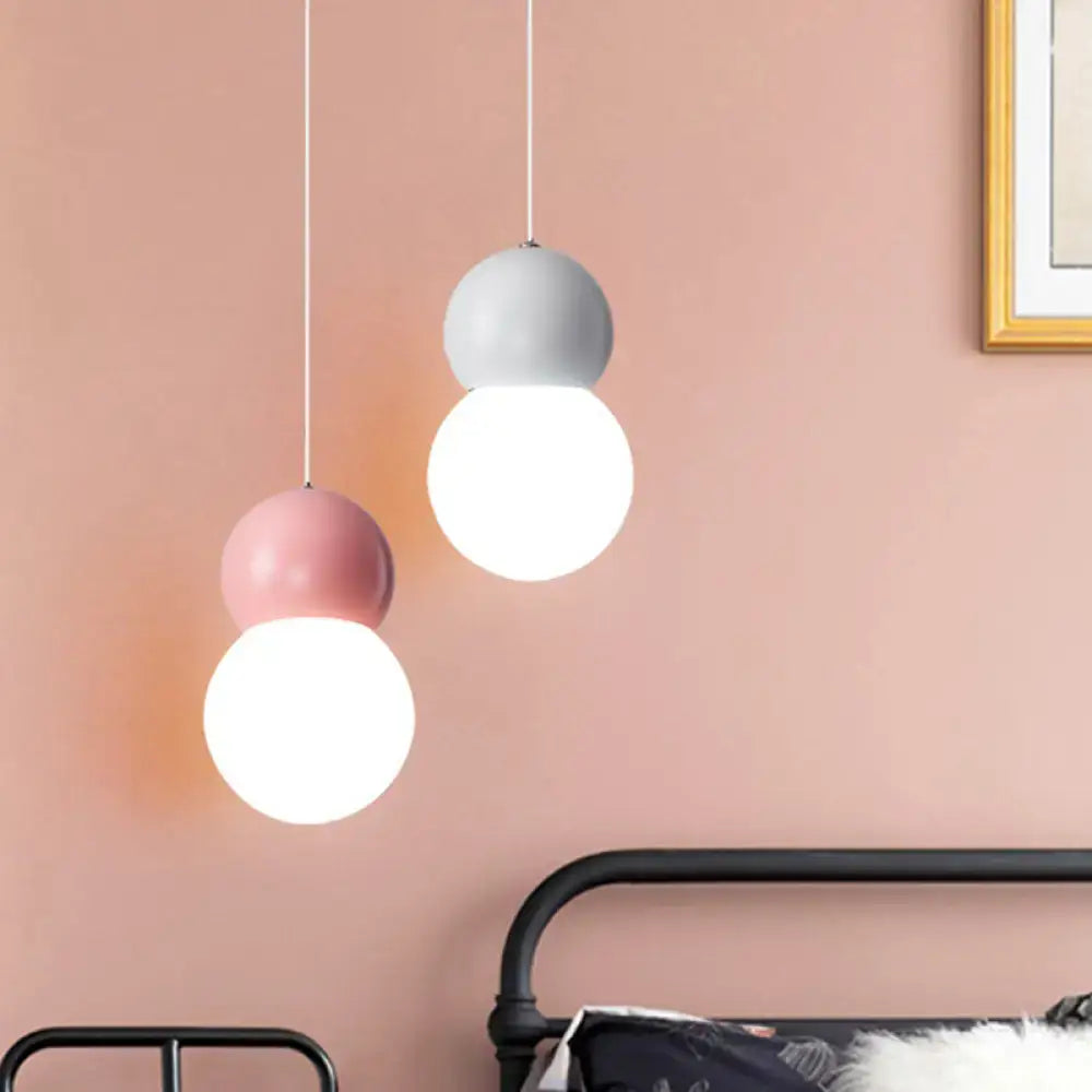 Pastel pink and gray kids bedside pendulum light with macaron ceiling pendant design and matte-finished stacked globes