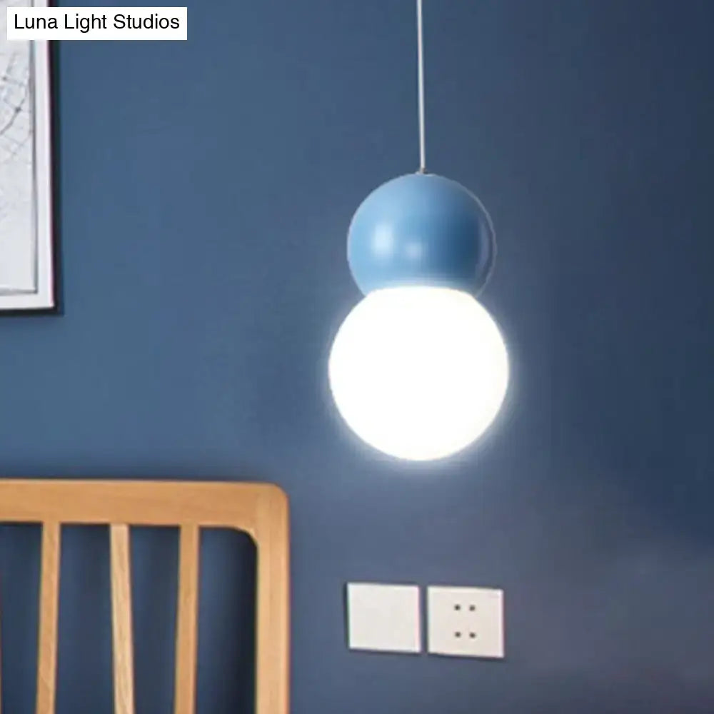 Decorbites kids bedside pendulum light with matte blue upper sphere and milky glass globe macaron ceiling pendant