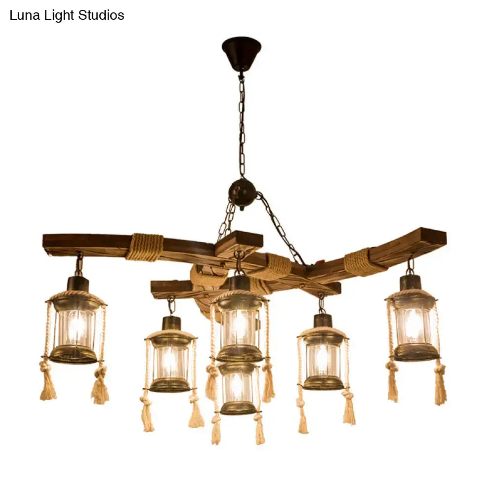 Rustic wooden chandelier with five lantern style lights clear glass brass frames and beige rope tassels for led incandescent use